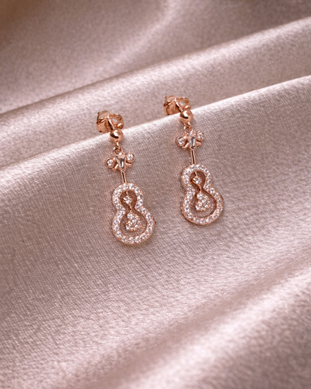 Jazz 925 silver earrings with rose gold polish and green stone detailing